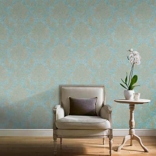 Light blue damask wallpaper feature wall in living room with cream armchair and side table
