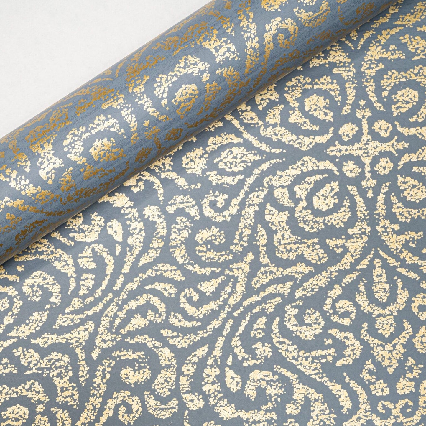 Blue Floral Damask Gold Metallic Shimmer Wallpaper roll showing gold shimmer finish and pattern detail