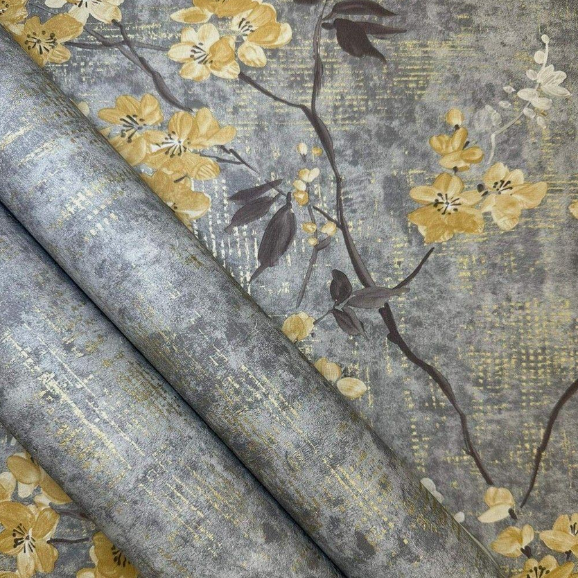 Anethe Blossom Wallpaper multiple rolls showing yellow floral blossom pattern on grey textured background