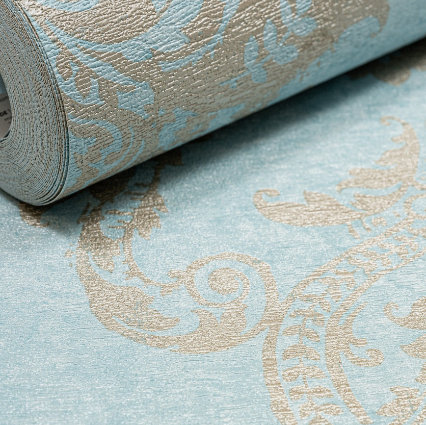 Capri Damask Teal Wallpaper roll close up showing texture and scrolling damask design