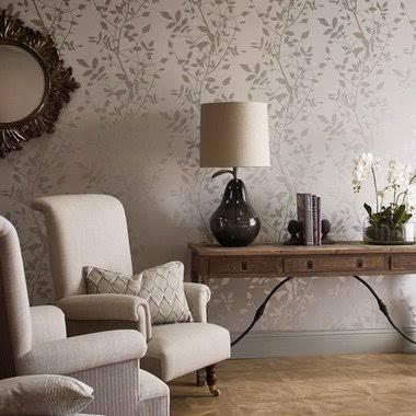 Silver Shadow Floral Wallpaper in elegant living room with cream armchairs and wooden console table