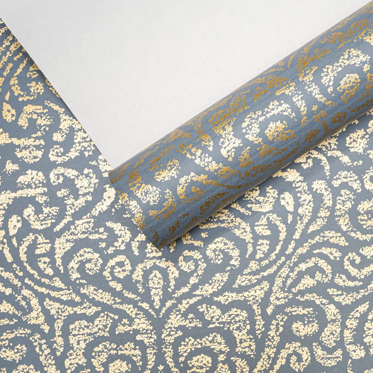 Blue Floral Damask Gold Metallic Shimmer Wallpaper roll with sample card showing colour and finish