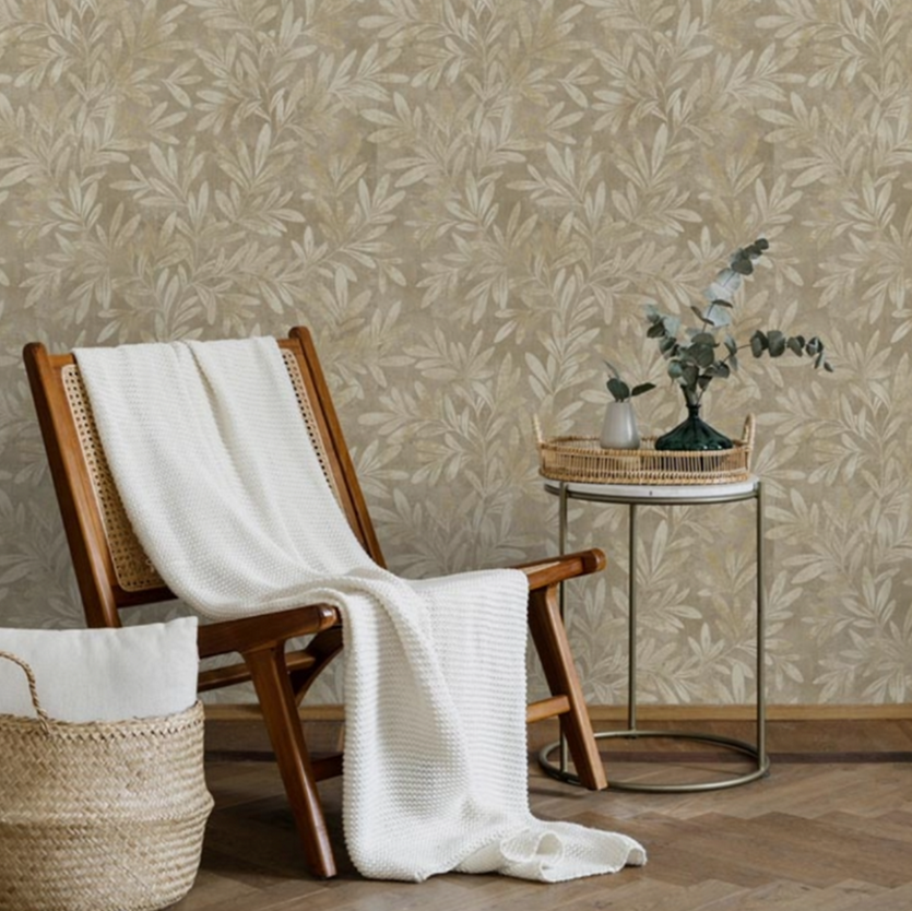 Willow Trail Taupe Natural Leaf Wallpaper in modern living room with wooden chair and rattan side table